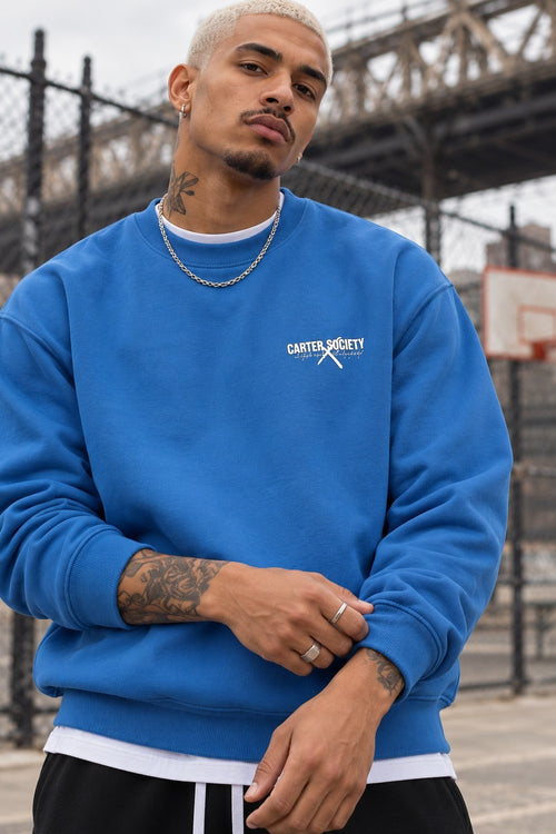 Legacy Sweatshirt Cobalt Blue, close-up of the chest logo